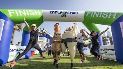 Participants finishing the Inflatathon obstacle course with flair. Leslie Pableo for The National