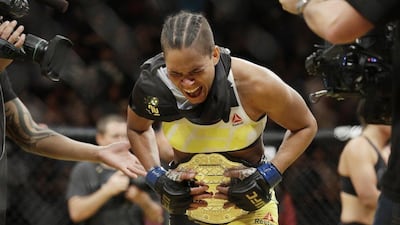 Amanda Nunes celebrates after defeating Miesha Tate during their women's bantamweight championship mixed martial arts bout at UFC 200, Saturday, July 9, 2016, in Las Vegas. John Locher / AP Photo