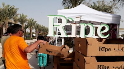 A customer picks up a box as he eyes up the produce on offer at Ripe market, Mushrif Central Park, Abu Dhabi, on April 25, 2015. Christopher Pike / The National