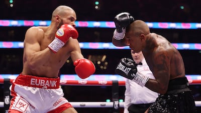 Conor Benn, right, shields from Chris Eubank Jr during their middleweight fight at Tottenham Hotspur Stadium. Getty Images