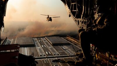 Australian Army CH-47 Chinooks from the 5th Aviation Regiment return from delivering hay bales to remote bushfire-affected farms on Kangaroo Island, Australia. Reuters