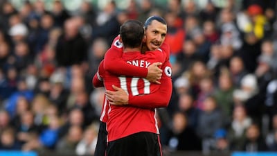 Manchester United striker Zlatan Ibrahimovic celebrates his second goal with Wayne Rooney on Sunday. Stu Forster / Getty Images / November 6, 2016