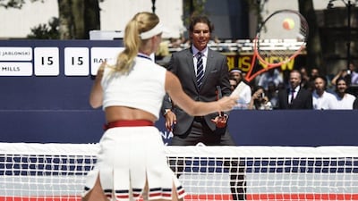 Rafael Nadal waits for a return from model Constance Jablonski, who he played in a tennis exhibition on Tuesday in New York. Justin Lane / EPA