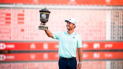 Xander Schauffele poses with the trophy after winning the WGC-HSBC Champions golf tournament in Shanghai. AFP