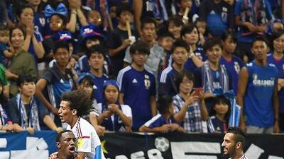 Ahmed Khalil, left, celebrates his and the UAE's second goal in a 2-1 win over Japan at Saitama Stadium 2002 in a 2018 World Cup qualifier on September 1, 2016. Atsushi Tomura / Getty Images