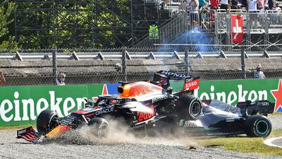 Red Bull's Max Verstappen and Mercedes' Lewis Hamilton crash out of the race. Reuters