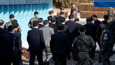 North Korea's chief delegate Ri Son Gwon (C, back) and delegates leave after meeting with South Korean delegates (not pictured) in the truce village of Panmunjom, North Korea, on January 9, 2018. Jung Ui-chel / EPA