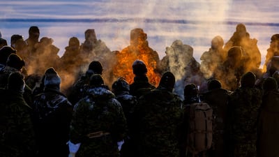Canadian military personnel light a signal fire during an annual series of drills centred on the defence of the Canadian Arctic. Reuters