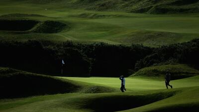 An amateur golfer walks on the seventh green during the first round of the Alfred Dunhill Links Championship at Kingsbarns, Scotland. Warren Little / Getty Images