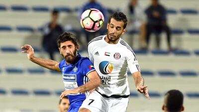 Ali Mabkhout of Al Jazira leaps for the ball during an Arabian Gulf League football match between Al Nasr and Al Jazira at Al Maktoum Stadium, Dubai. 17 December 2016. Photo Courtesy: Arabian Gulf League