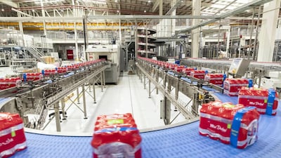 Six pack water bottles on the assembly line at the Mai Dubai factory. Antonie Robertson/The National