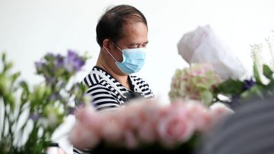 Florists at Florette prepare flowers and bouquets for delivery with Covid-19 prevention measures in place, Dubai. Chris Whiteoak / The National