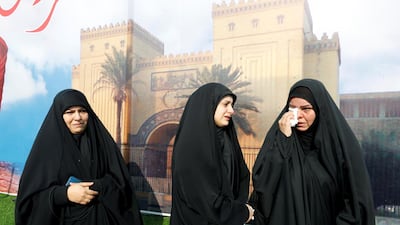 Mourners react as they attend the funeral of the Iranian Major-General Qassem Soleimani, head of the elite Quds Force of the Revolutionary Guards, and the Iraqi militia commander Abu Mahdi al-Muhandis, who were killed in an air strike at Baghdad airport, in Baghdad. REUTERS