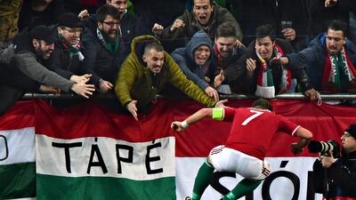 Hungary’s captain Balazs Dzsudzsak celebrates scoring with fans during the friendly football match Hungary v Croatia at the Ferenc Puskas Stadion in Budapest, Hungary. Attila Kisbenedek / AFP