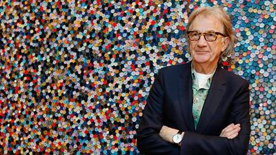 Fashion designer Paul Smith poses after an interview with Reuters at the media launch of the exhibition "Hello, My Name is Paul Smith", at the Design Museum in London November 14, 2013. When British fashion designer Paul Smith started his career more than 40 years ago in a tiny shop in Nottingham, little did he know he would build a global fashion empire worth millions on his ability to find inspiration from his surroundings REUTERS/Luke MacGregor (BRITAIN - Tags: ENTERTAINMENT FASHION BUSINESS SOCIETY)