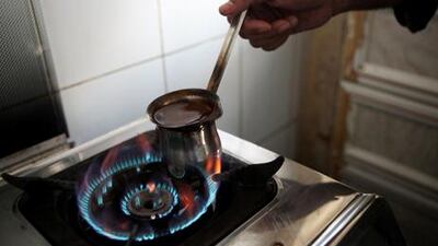 Mohammed Mustafah makes arab coffee at The Garden Coffee Shop in Abu Dhabi.