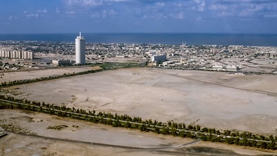 An aerial view from the 1980s of Dubai with the World Trade Centre Tower looking out over Al Satwa. Alamy