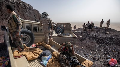 Yemeni fighters backed by the Saudi-led coalition patrol during clashes with Houthi rebels on the Kassara front line near Marib, Yemen. AP