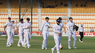 England's Ben Duckett walks off the field holding his wrist at the end of Pakistan first innings. Reuters