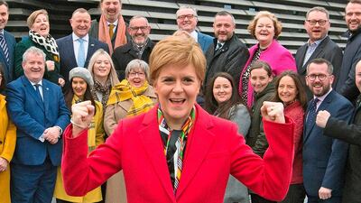 Scottish National Party leader and Scotland's First Minister Nicola Sturgeon poses with SNP's newly-elected MPs after a successful campaign. AFP