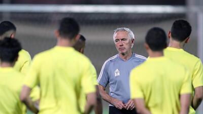 UAE manager Bert van Marwijk talks to his players during training before the game between the UAE and Vietnam. Chris Whiteoak / The National