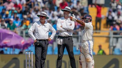 India's Rishab Pant, right, speaks to umpires Michael Gough, center, and Richard Illingworth after his controversial dismissal on Sunday. AP