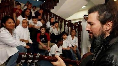 Ron ‘Bumblefoot’ Thal was kindness itself with the children and smiled as one of them played with his long beard, which was wrapped tightly in chains.