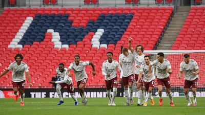 Arsenal players celebrate after Pierre-Emerick Aubameyang's winning penalty. EPA