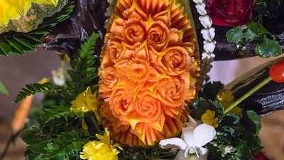 A carved papaya is displayed during a fruit and vegetable carving competition in Bangkok. Robert Schmidt / AFP