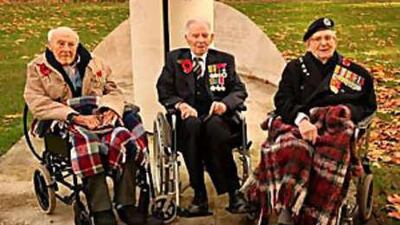 British First World War veterans, left to right, Henry Allingham, 112, Harry Patch, 110 and Bill Stone, 108, pose for pictures before the start of Armistice Day commemorations in London. They were later present in France for the commemorations at the site of the Battle of Verdun.