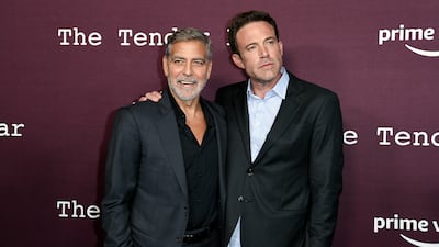 Wedding guest George Clooney and groom Ben Affleck arrive at a screening of The Tender Bar at the Directors Guild of America in Los Angeles. Invision / AP
