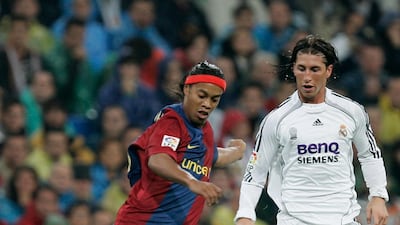 Ronaldinho of Barcelona and Ramos in action during a La Liga match in 2006.