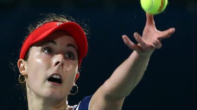 France's Alize Cornet serves the ball to Spain's Carla Suarez-Navarro during their quater-final match in the Dubai Duty Free Tennis Championship on February 20, 2014. AFP PHOTO / MARWAN NAAMANI