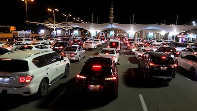 Cars wait in line to enter Bahrain from Saudi Arabia on the King Fahd Causeway after Saudi citizens were allowed to travel outside the kingdom for the first time in 14 months. Reuters