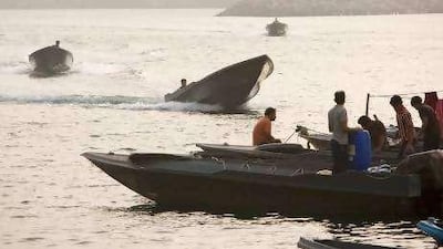 Speedboats arrive at the Port of Khasab, in Oman's isolated peninsula of Musandam, where the black market flourishes.