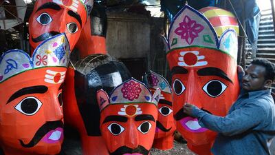 Indian artist N Shankar makes effigies of the Hindu demon king Ravana to celebrate the Dushhera-Vijaya Dashami festival at a workshop in Hyderabad. Noah Seelam / AFP Photo