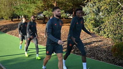 Chelsea midfielder Christian Pulisic arrives with teammates for training. AFP