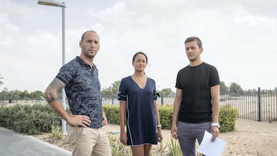 Town Square residents Gabriel Martinez, Kessie Bebel and Ghadir Shaar pictured near the land beside their homes that is being used by partying quad bikers and speeding motorists. Antonie Robertson / The National