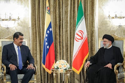 Iran's former president, Ebrahim Raisi, with Venezuela's now deposed president Nicolas Maduro in Tehran. AFP