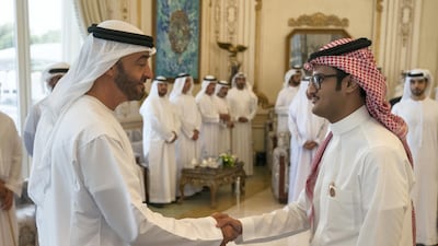 Sheikh Mohamed receives a member of the Young Arab Media Leaders Programme, during a Sea Palace barza. Hamad Al Kaabi / Ministry of Presidential Affairs