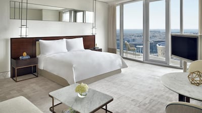A premier room in the hotel, featuring floor-to-ceiling windows with views of Downtown Dubai