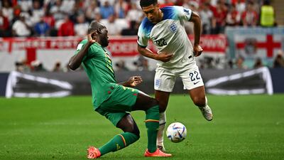 Senegal's Kalidou Koulibaly battles with England's Jude Bellingham. AFP