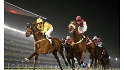 Alo Pura, left, ridden by William Buick, wins the Al Tayer Motors at Meydan Racecourse last night.