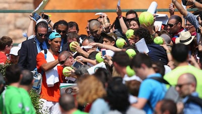 Rafael Nadal of Spain signs autographs on his way off the practice court during day two of the ATP Monte Carlo Rolex Masters Tennis at Monte-Carlo Sporting Club on April 14, 2014 in Monte-Carlo, Monaco. Julian Finney/Getty Images