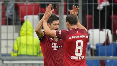 Lewandowski, left, celebrates after scoring his side's second goal. AP