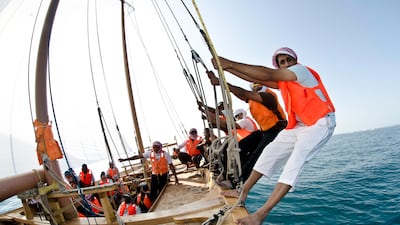 Volvo Ocean Race crew members compete in the The Abu Dhabi Sailing Festival Race in 60ft Dhow boats, during the Volvo Ocean Race 2011-12 in Abu Dhabi. (Photo Credit Must Read: MARC BOW/Volvo Ocean Race)