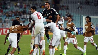 The UAE celebrate after beating Japan on penalties in the Asian Cup quarter-finals on Friday in Australia. They face the hosts in the semi-finals on Tuesday. Saeed Khan / AFP / January 23, 2015