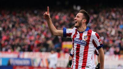 Atletico Madrid midfielder Saul Niguez celebrates after scoring his team's second goal during their La Liga win on Saturday over Real Madrid. Cesar Manso / AFP