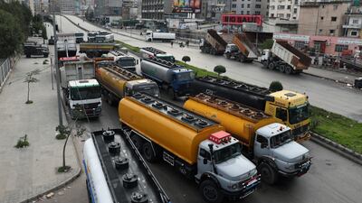 Lorry drivers block a main road with their vehicles during a general strike by public transport and workers' unions, protesting against the country's deteriorating economic and financial conditions, in Beirut, Lebanon. AP