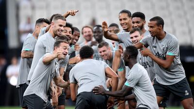 Alexander-Arnold of Liverpool runs through a line of Liverpool players. Getty Images